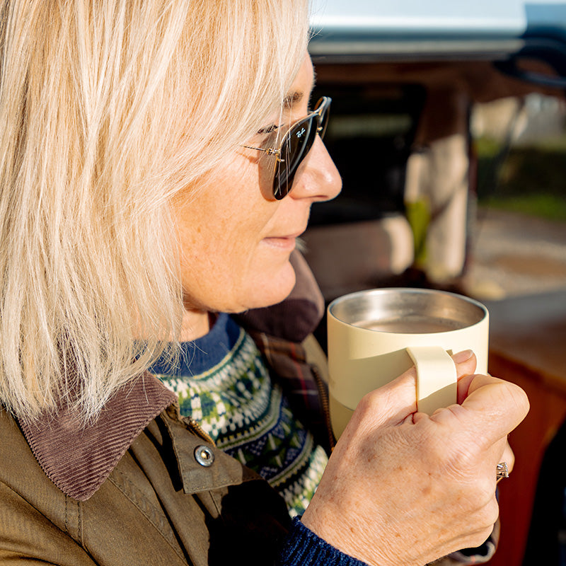 12oz-rise-mug-e0 12oz_rise_coffee_mug_wax_yellow_woman_drink_closeup_square.jpg