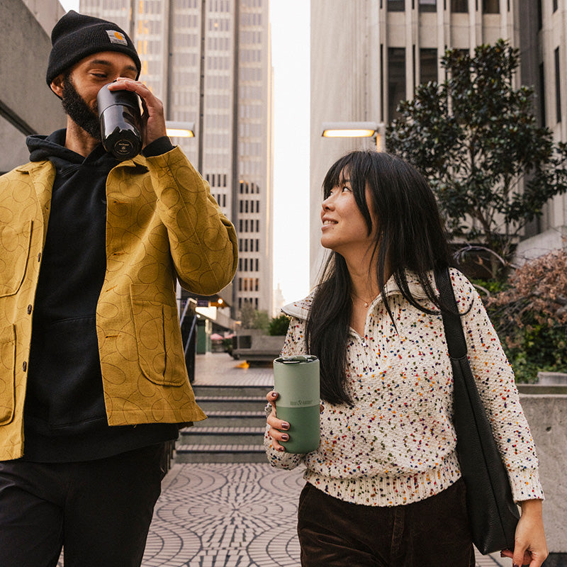 16oz-rise-tumbler-n2 16oz_rise_tumbler_black_iceberg_couple_drink_city_street_square.jpg