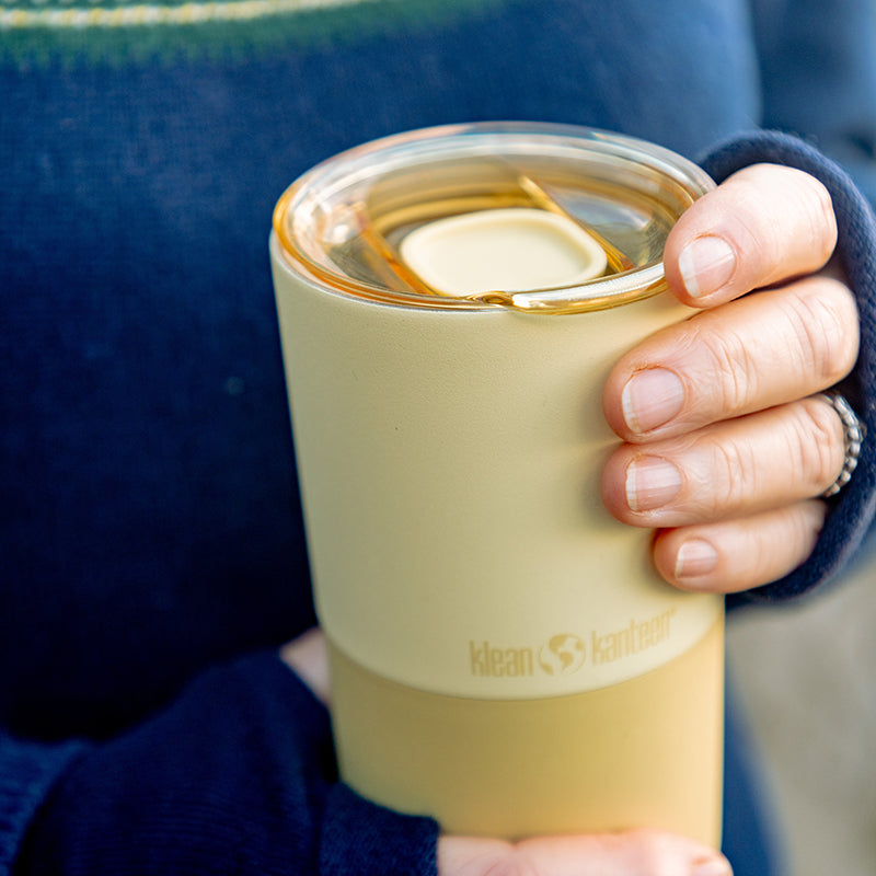 daily-on-the-go-set-p2 16oz_rise_tumbler_wax_yellow_closeup_hand_lid_square.jpg
