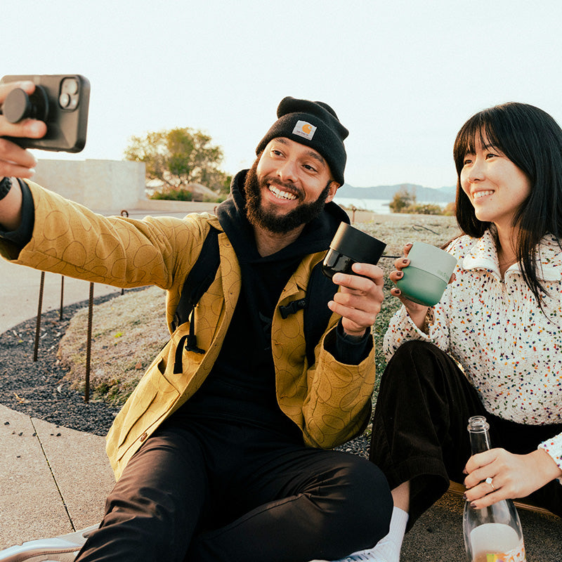 bring-your-own-party-kit-tumblers-and-cocktails-b6 8oz_rise_lowball_black_iceberg_couple_selfie_city_square.jpg