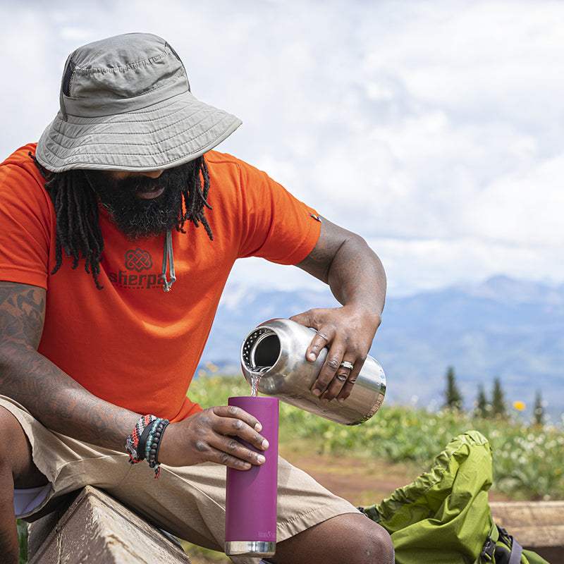 64oz-tkwide-with-loop-cap-m0 tkwide_64oz_bottle_backpacker_mountains_filling_square.jpg